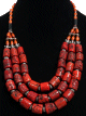 Collier ethnique style berbere artisanal en pieces imitation corail rouge agencees de pieces argentees ciselees