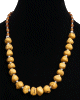 Collier ethnique artisanal imitation pierres difformes jaunes agremente de perles en metal et d'autres en bois